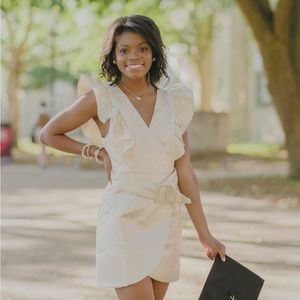 Cream mini dress with ruffled sleeves and silver dots